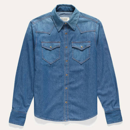 Front view of the Western Snap Shirt in Washed Chambray featuring dual chest pockets, faux tortoise snap buttons, and a classic Western silhouette in faded blue cotton chambray.