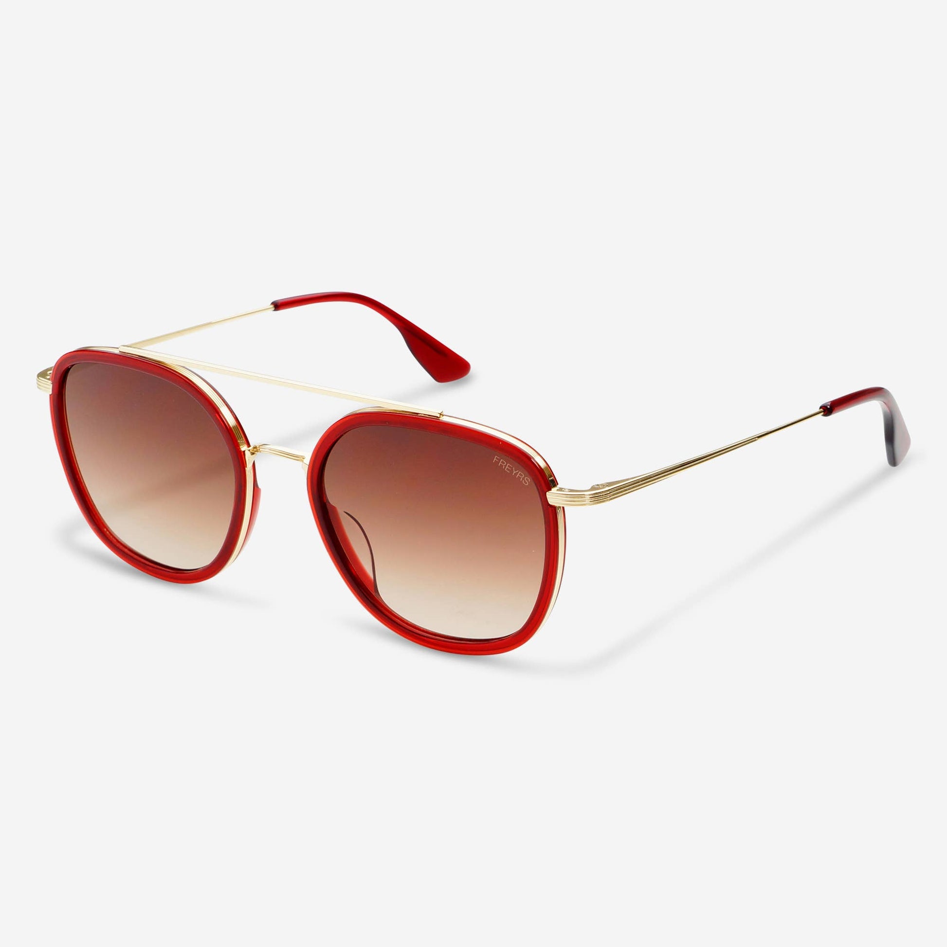 Angled view of the Weston round unisex sunglasses featuring red acetate frames, brown lenses, and slender gold-tone arms.