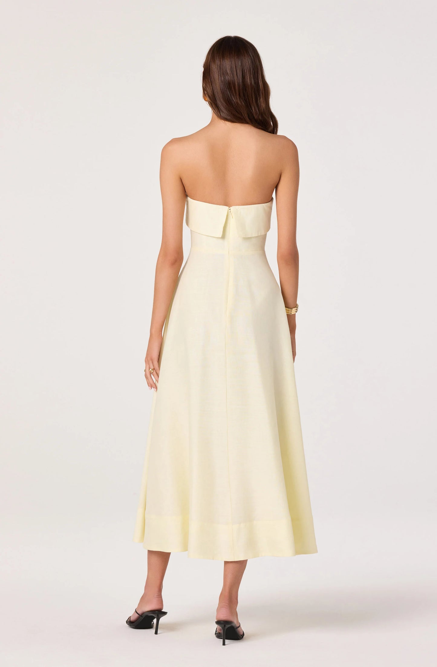 Back view of the Ximena Floral Strapless Midi Dress showing the strapless neckline, fitted bodice, and concealed center back zipper.
