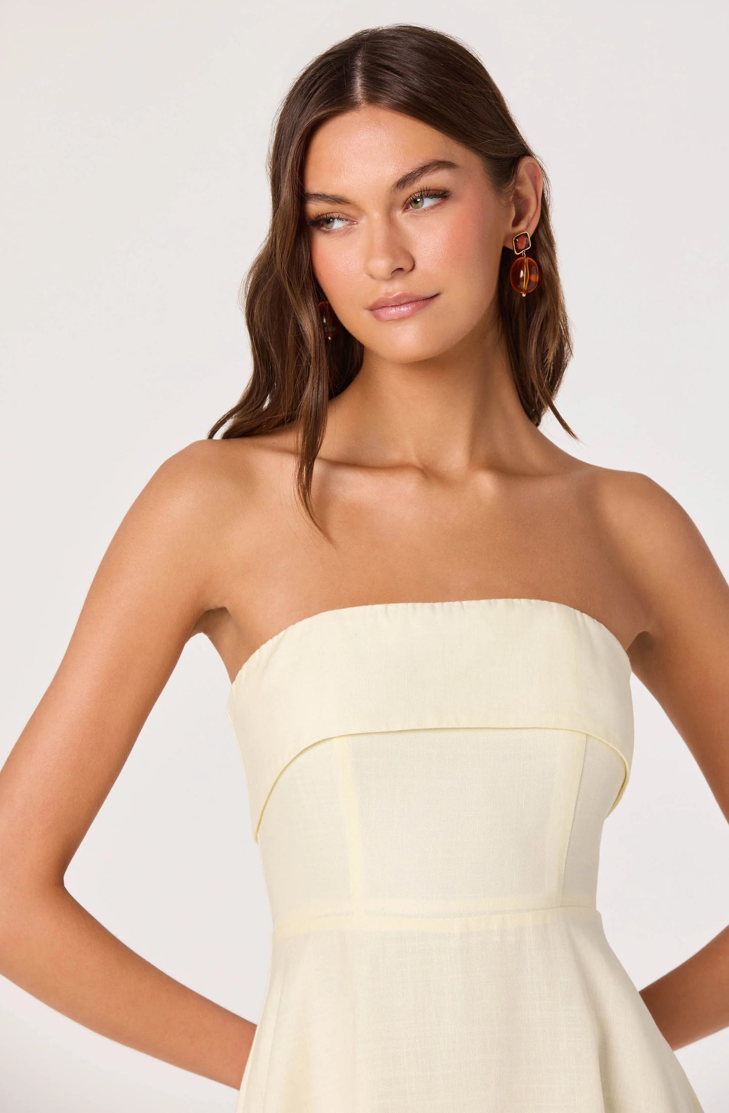 Close-up of the Ximena Floral Strapless Midi Dress showing the strapless foldover neckline and structured boned bodice.