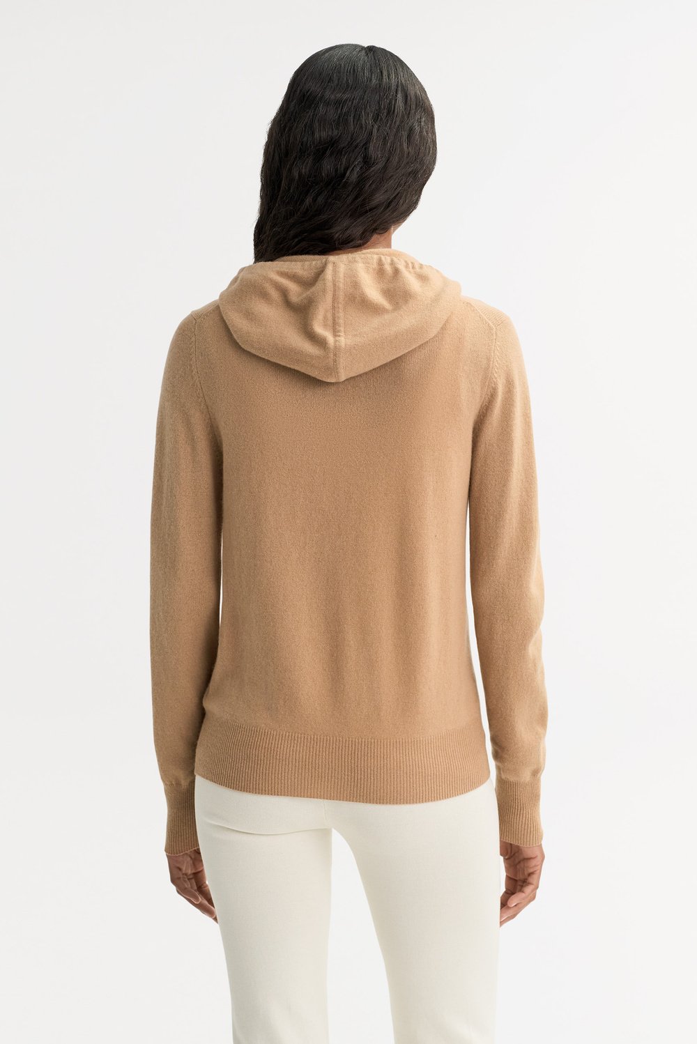 Women's camel cashmere zip hoodie shown from the back with hood and ribbed hem detailing