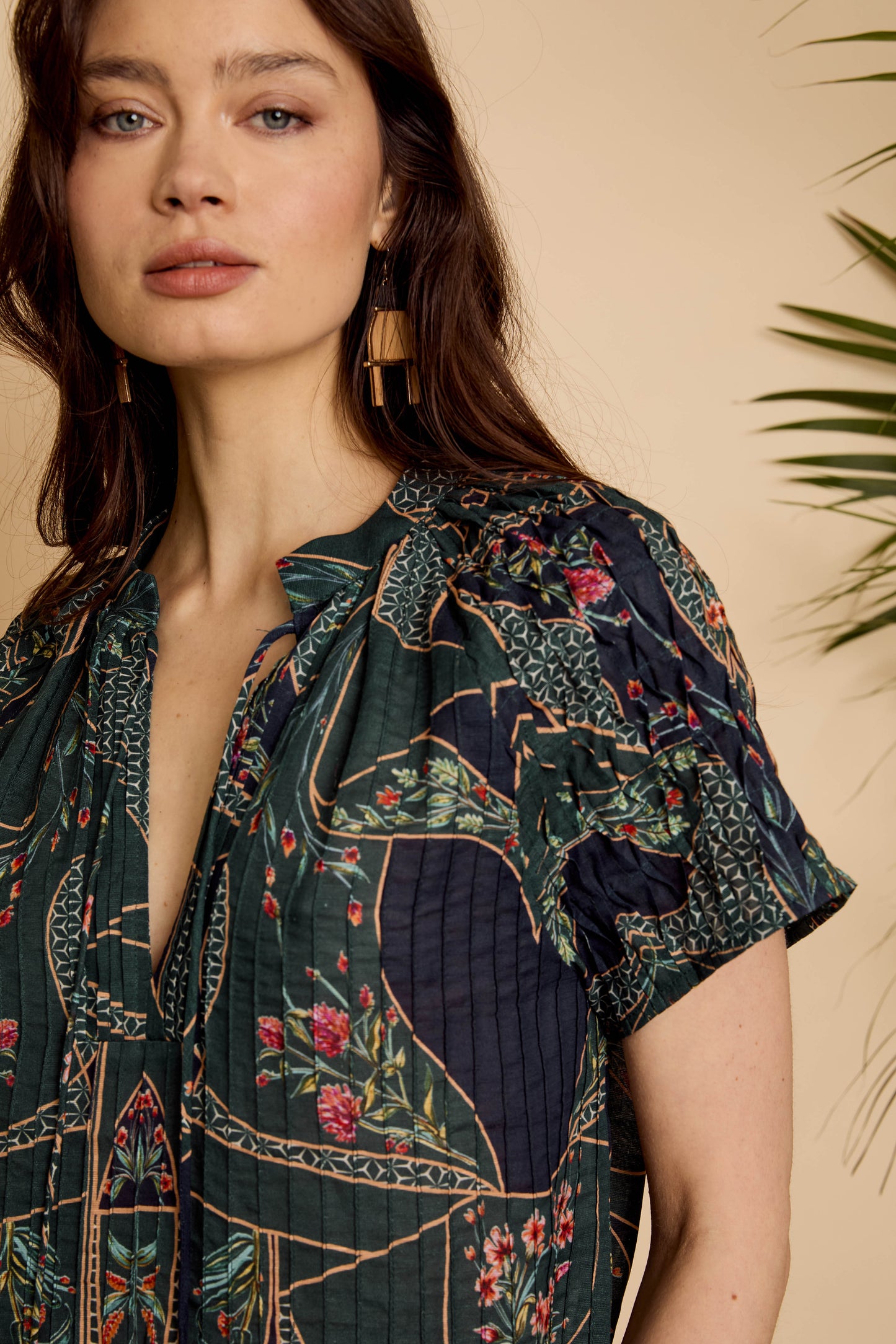 Close-up of the Zola Top in Patchwork Flower highlighting the mixed floral print, gathered neckline, and short sleeve detail