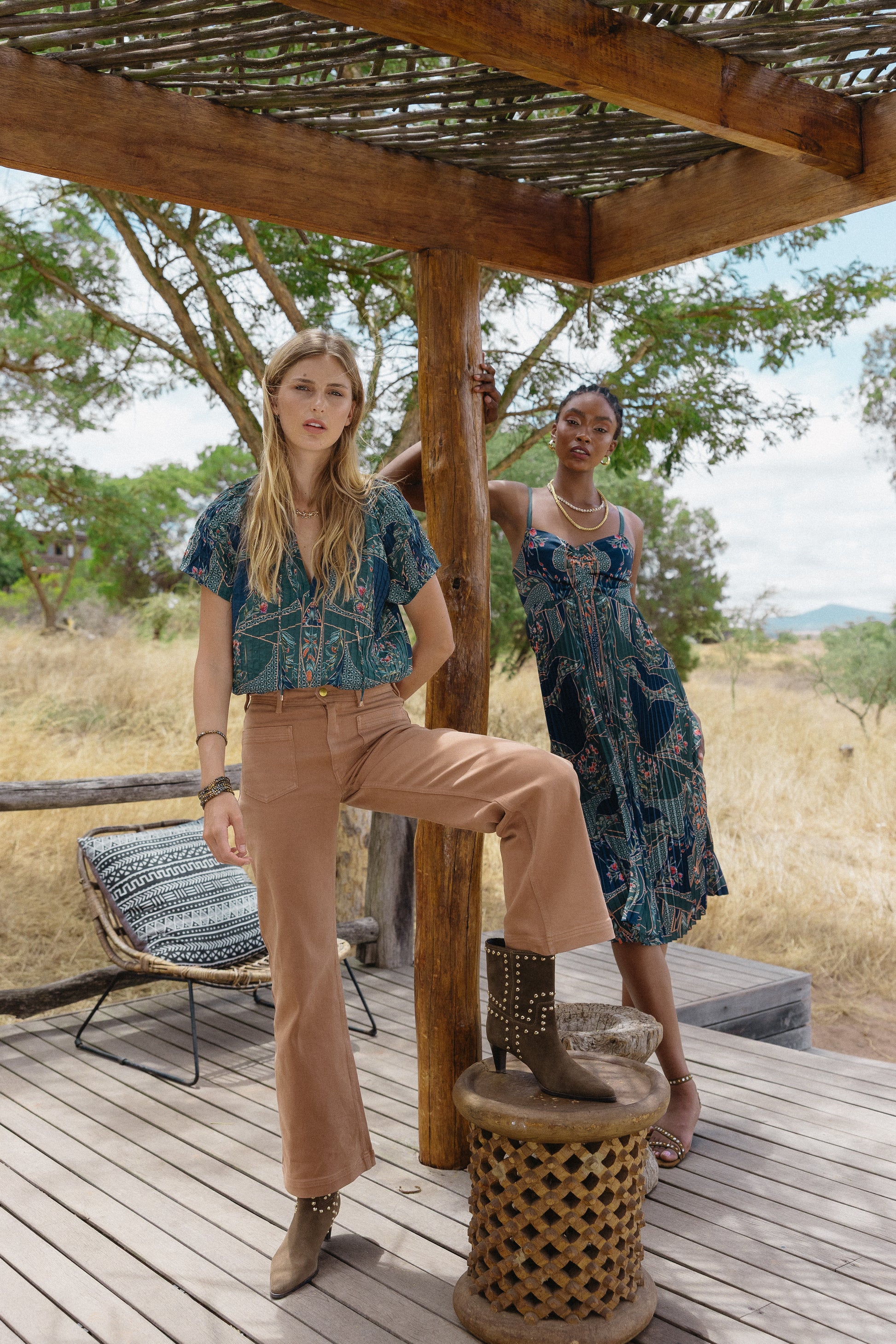 Model wearing the Zola Top in Patchwork Flower in an outdoor editorial setting with coordinated seasonal styling