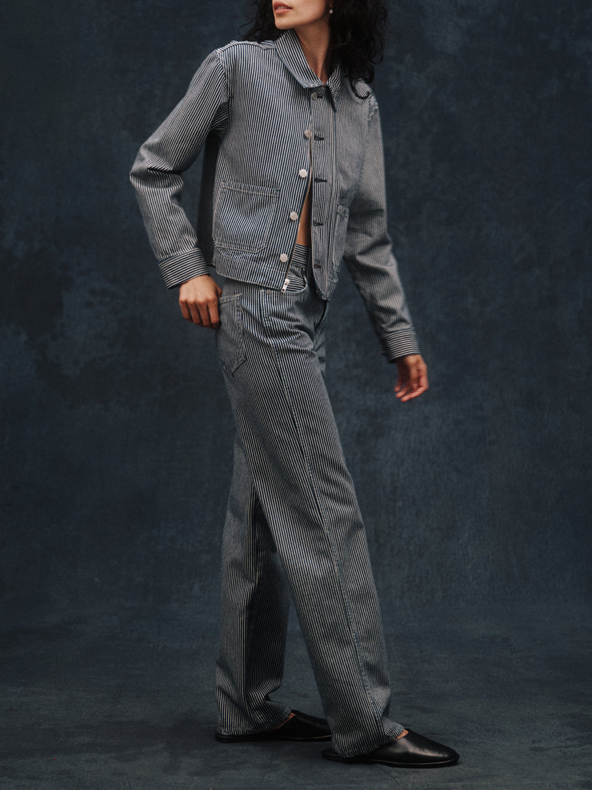 Woman wearing the Little Rowdy Annette Jean in blue and ivory striped denim with the matching Cadet Jacket
