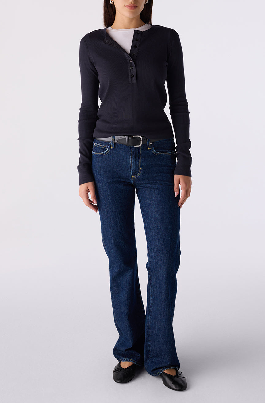 Woman wearing the Little Rowdy Marcenia Jean in dark indigo denim, front view