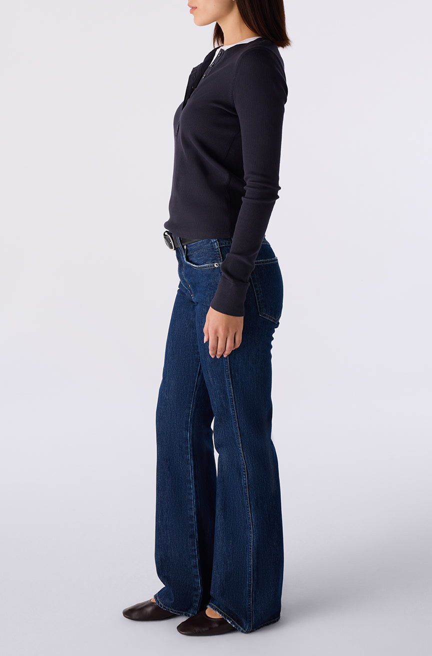 Woman wearing the Little Rowdy Marcenia Jean in dark indigo denim, side view